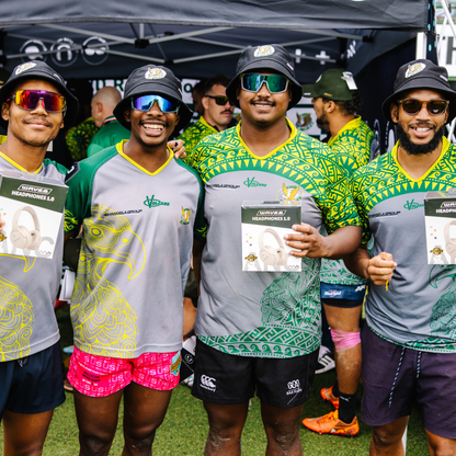 Group of people wearing sports jerseys and sunglasses, standing together